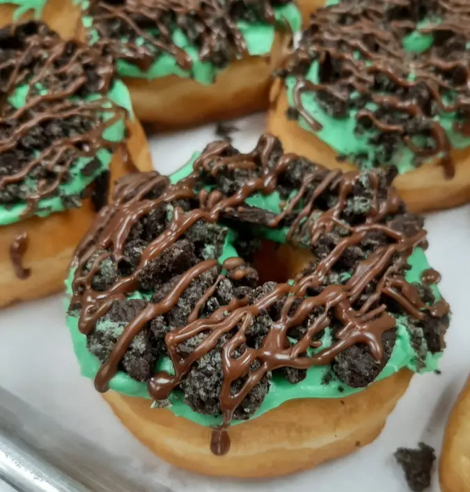 Mint Oreo donut topped with crushed cookies and chocolate drizzle at Laila’s Place in Newberry, SC